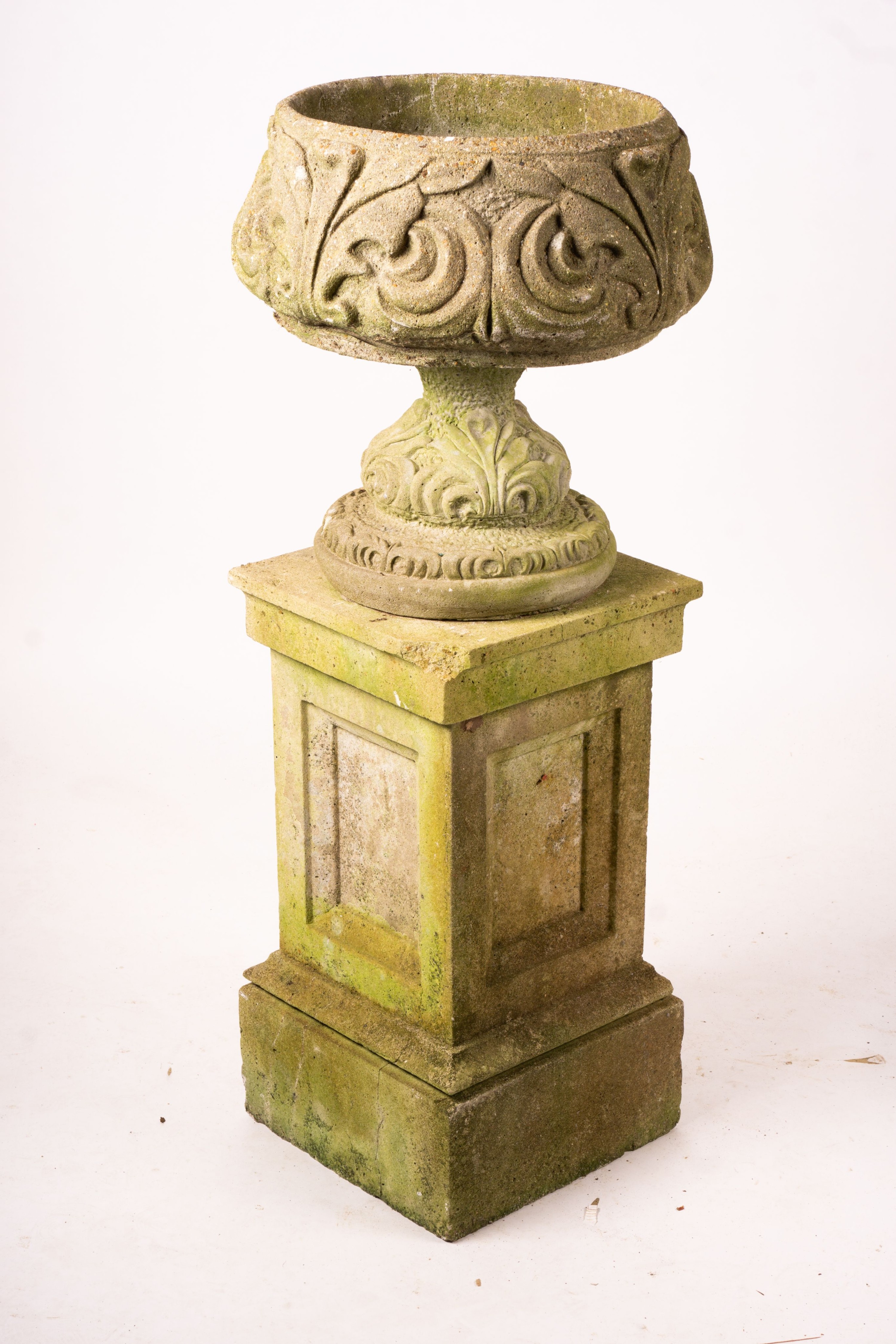 A pair of reconstituted stone circular garden planters on pedestal bases, diameter 45cm, height 110cm